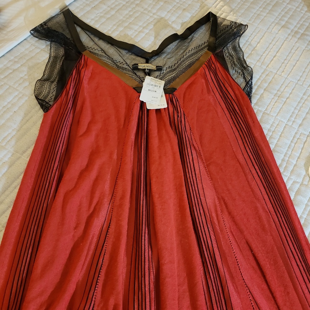 A Rozae Nichols red dress meant to be seen